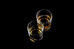An image of two shot glasses with liquor inside