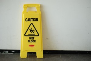 A caution for wet floor signage on the floor